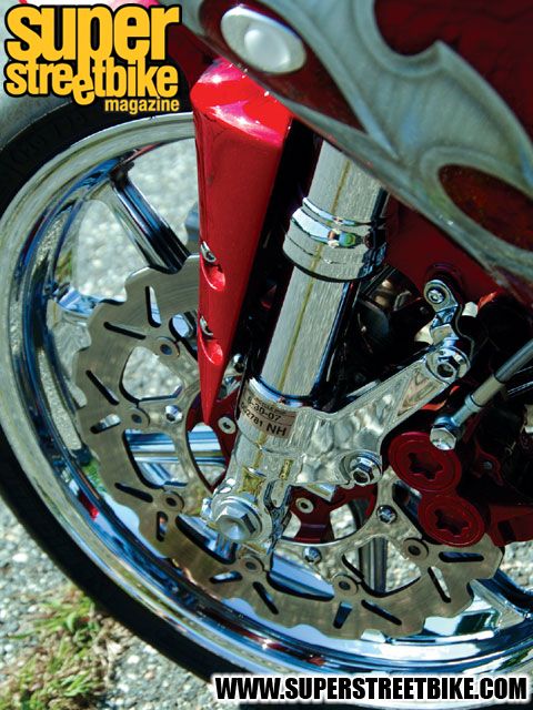 0702_sbkp_02_z 2002_yamaha_r1 left_front_fork.jpg